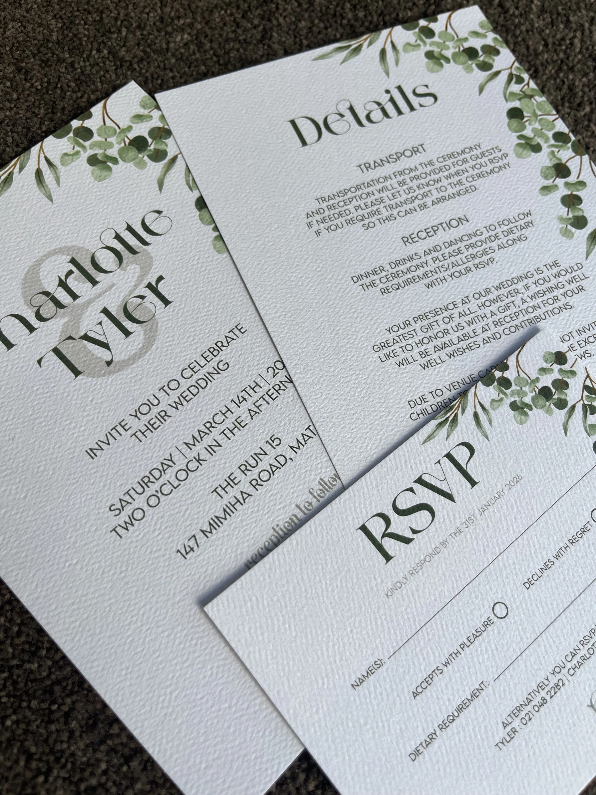 Wedding invitation and RSVP card with a green leafy border design.