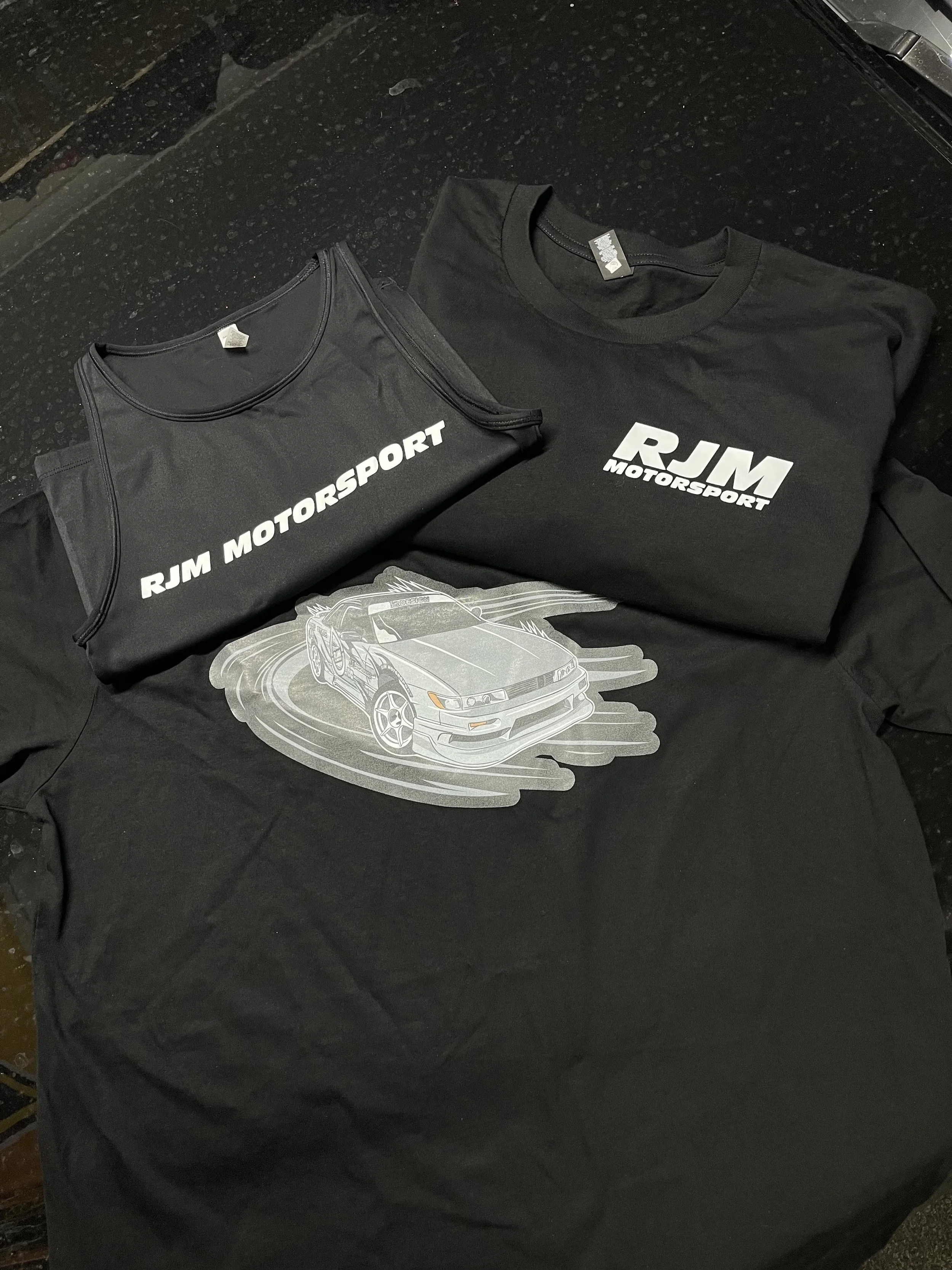 Drift team apperal on tshirts and singlets