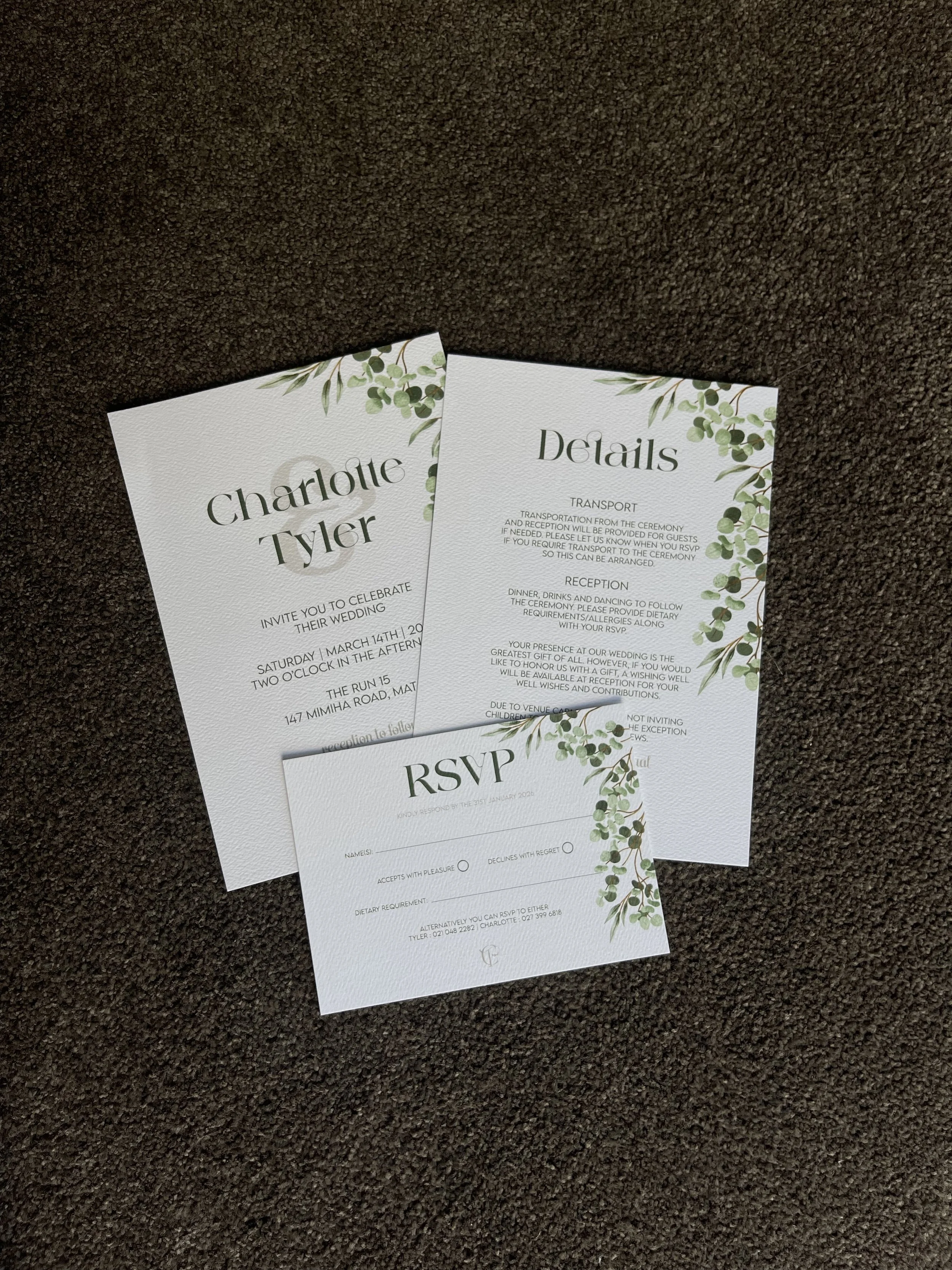 Wedding invitation and RSVP cards with green foliage design.