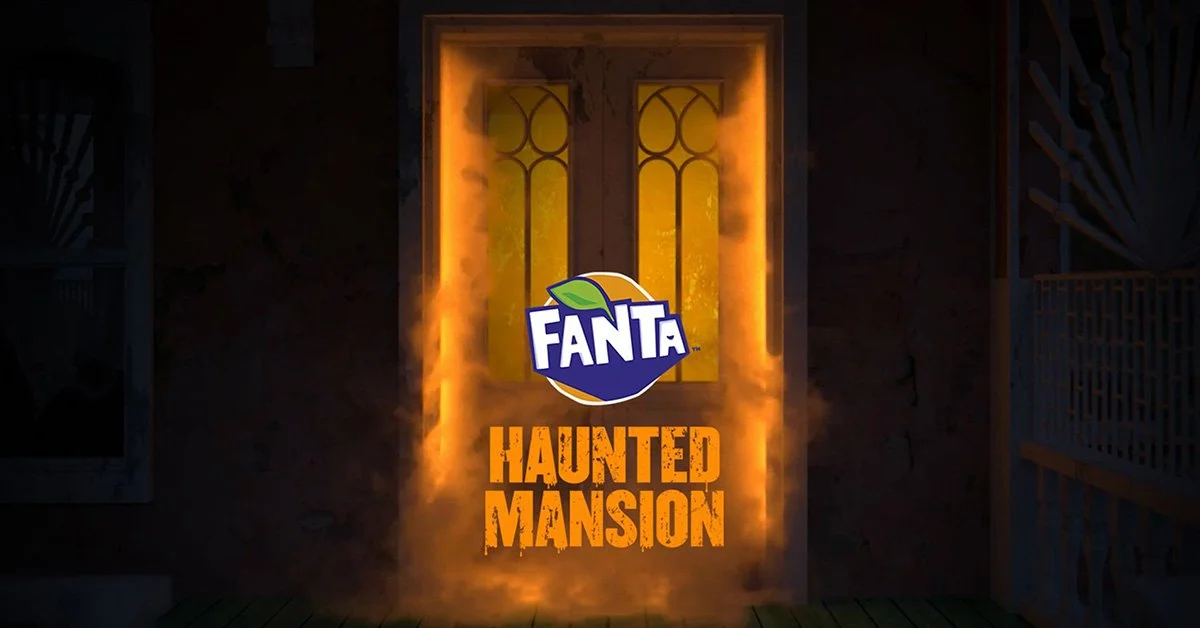 Fanta Haunting Mansion entrance with glowing yellow window and fiery doorway.