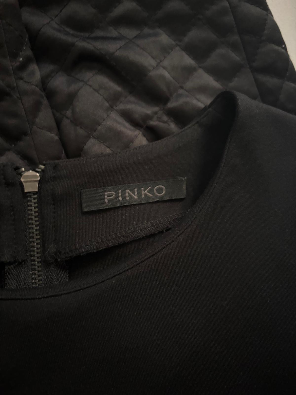Pinko original brand label inside black designer dress, authentic luxury garment tag