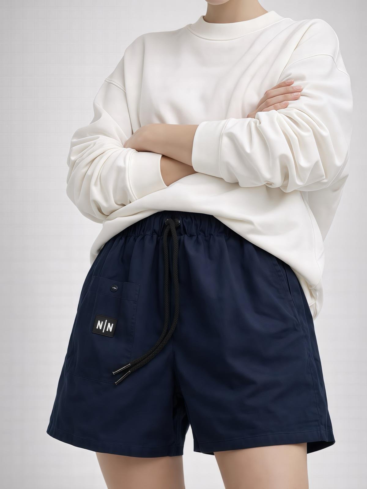 Nafsi unisex harem shorts navy blue on model