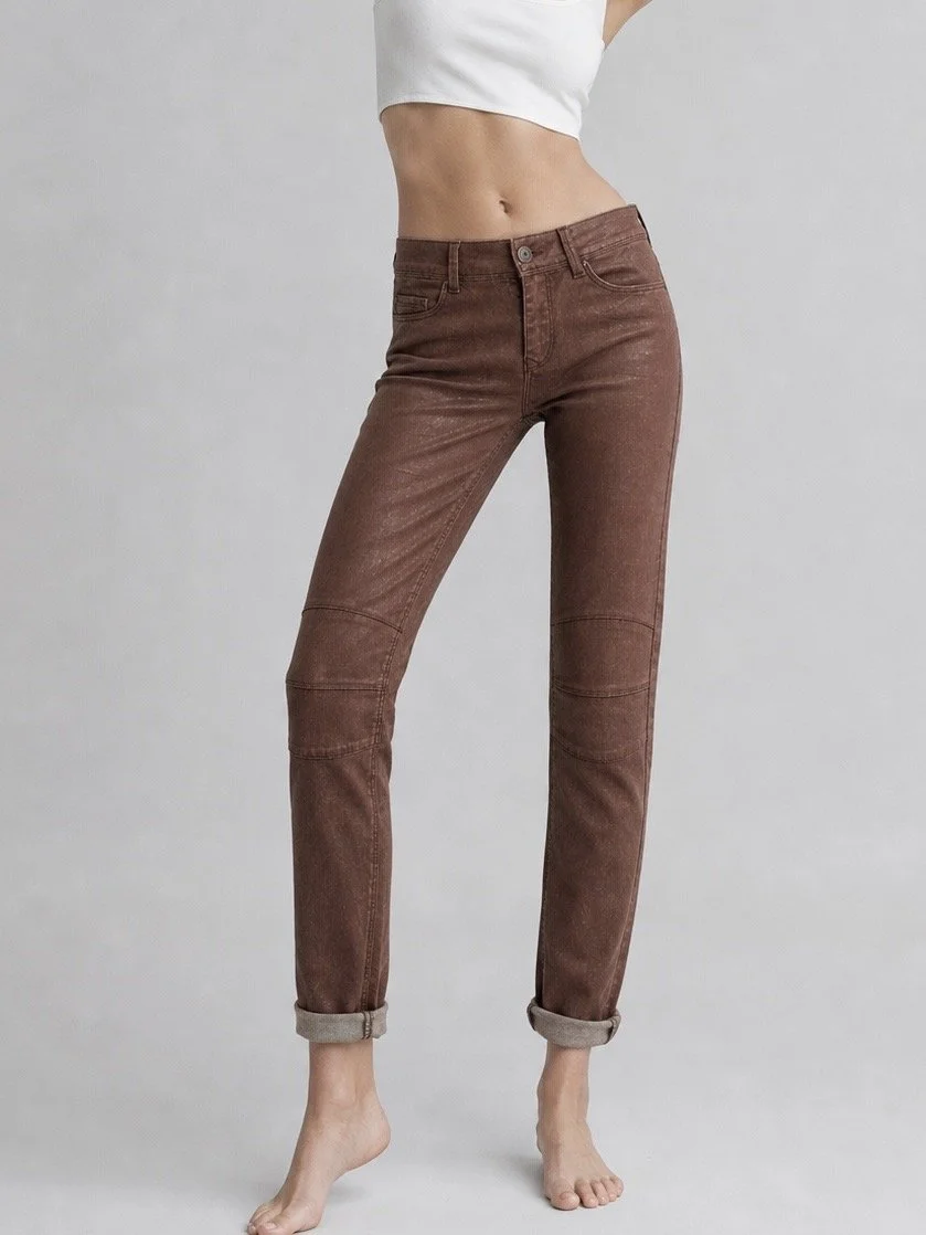 NÜ Denmark metallic brown skinny jeans close-up with knee panel detailing and rolled hems