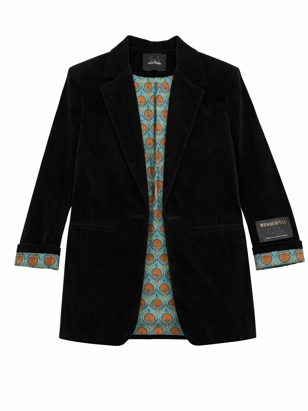 Black velvet blazer with green floral lining on sleeves