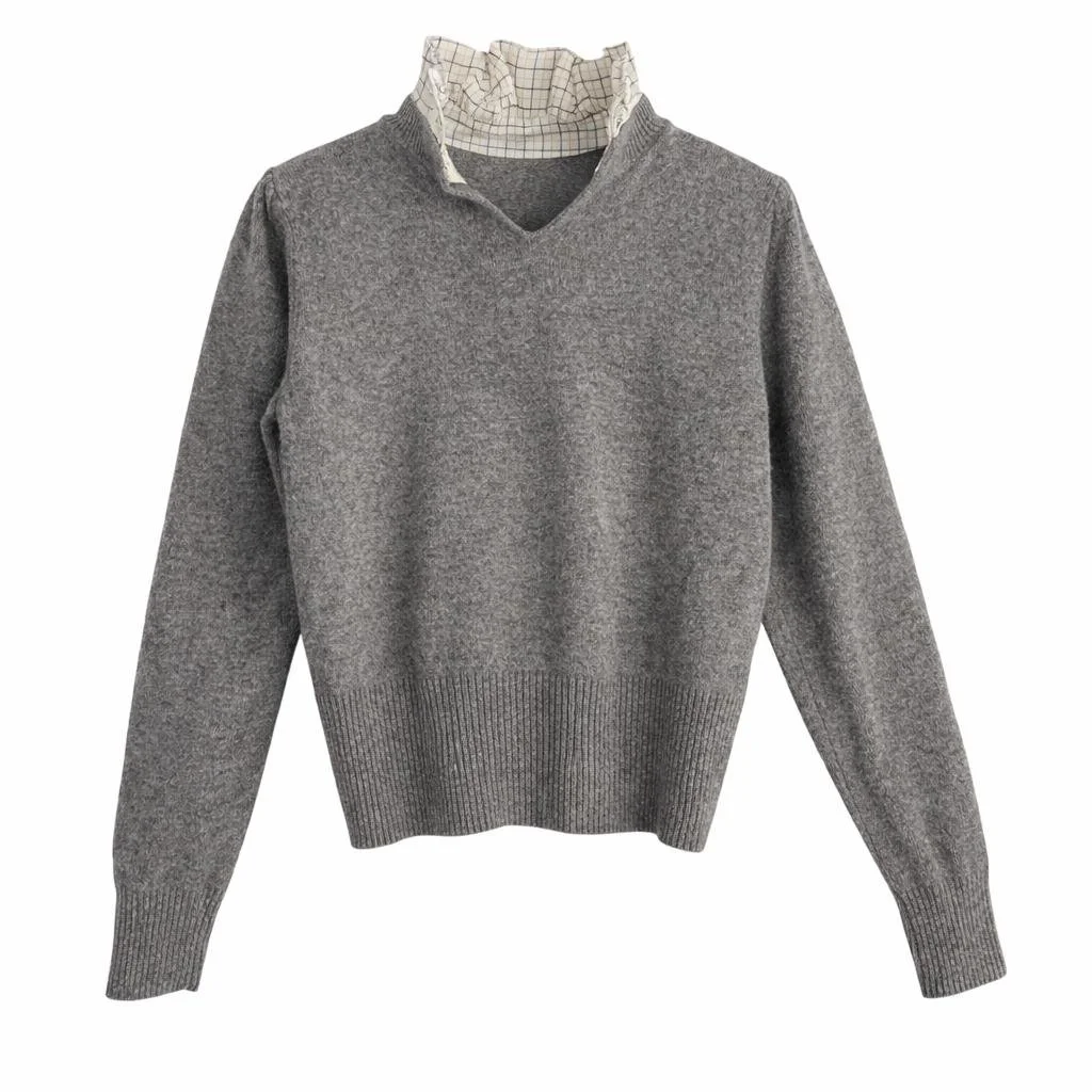 Back view of Sandro grey wool sweater with fitted waist