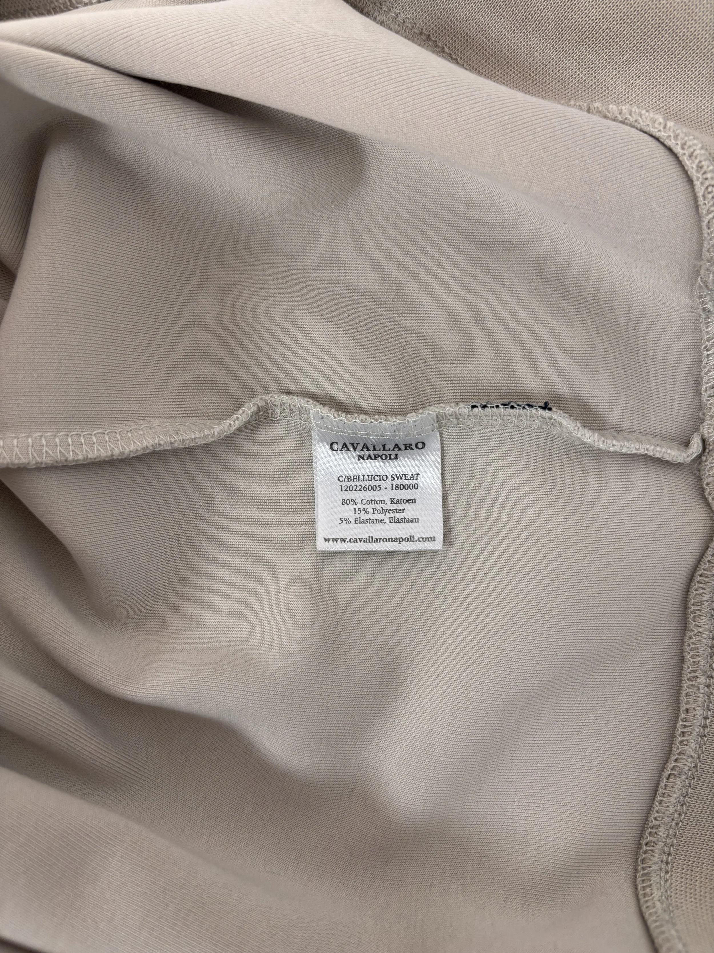 Interior label of Cavallaro Napoli men’s cream beige sweatshirt showing brand details and fabric composition with cotton blend construction.