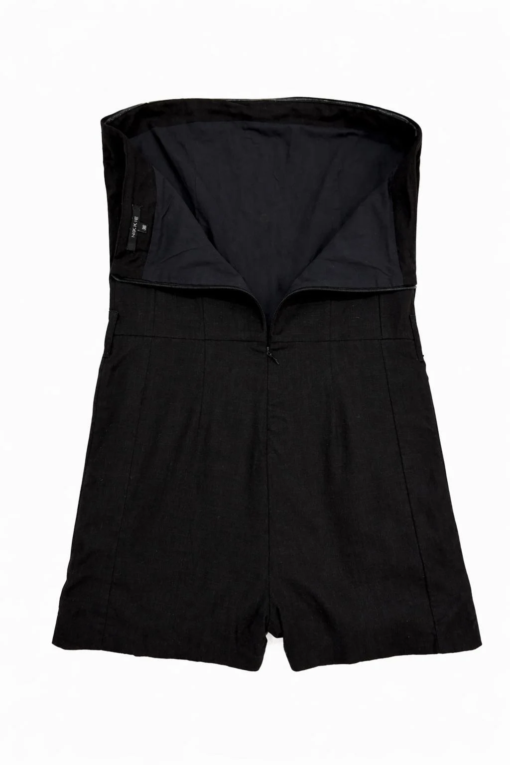 Inside view of black NIKKIE strapless shorts jumpsuit showing lining and structure – designer resale Norée. Virtual Preview Available