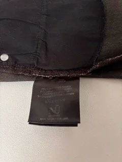 NÜ Denmark coated skinny jeans inner label showing fabric composition and stretch material blend