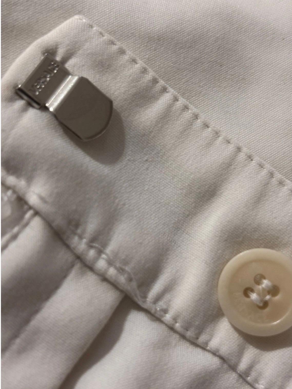 Gianni Versace cream tailored trousers waistband button and metal clasp fastening detail