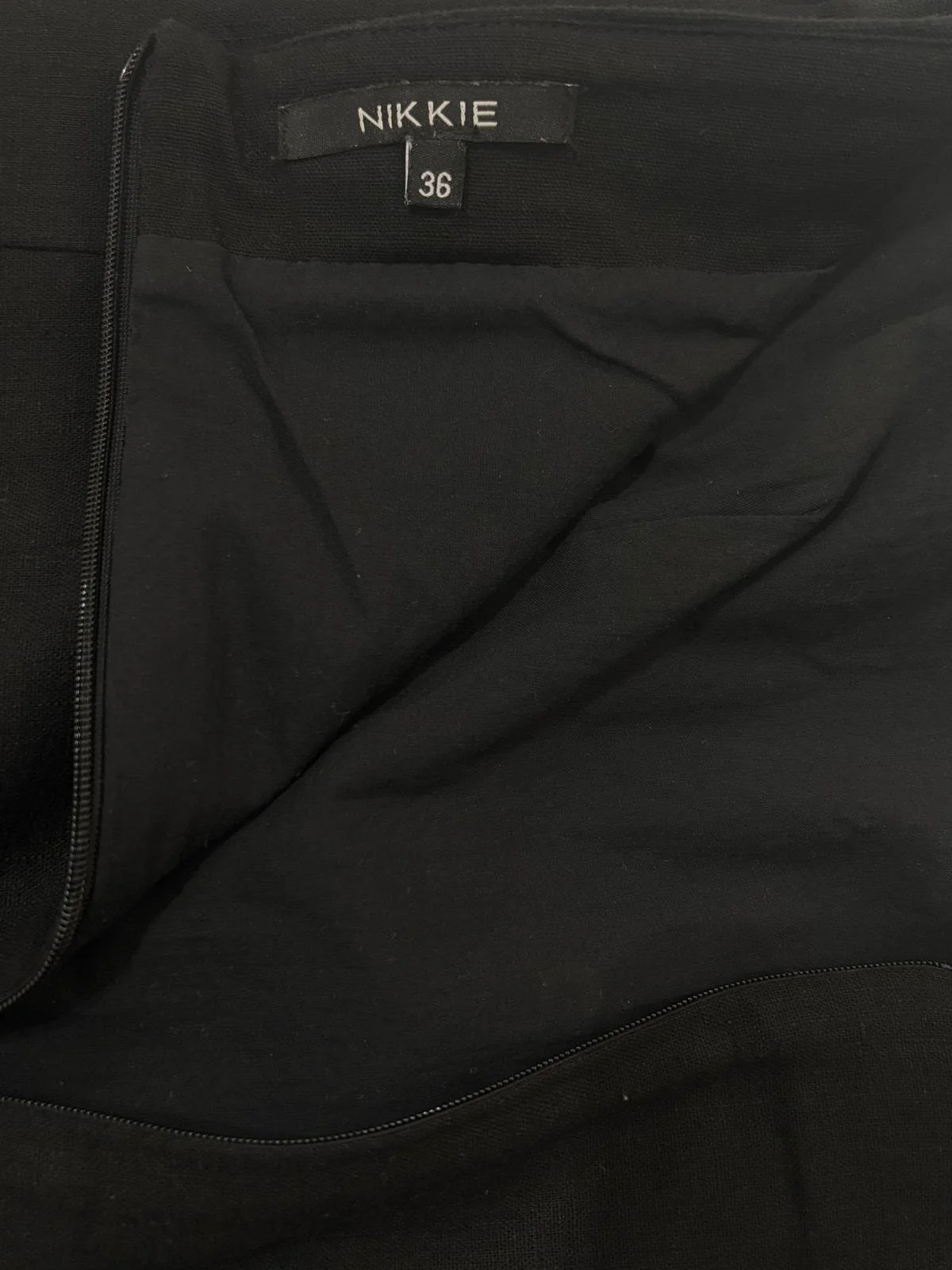 NIKKIE black strapless playsuit interior lining and back zipper detail close up