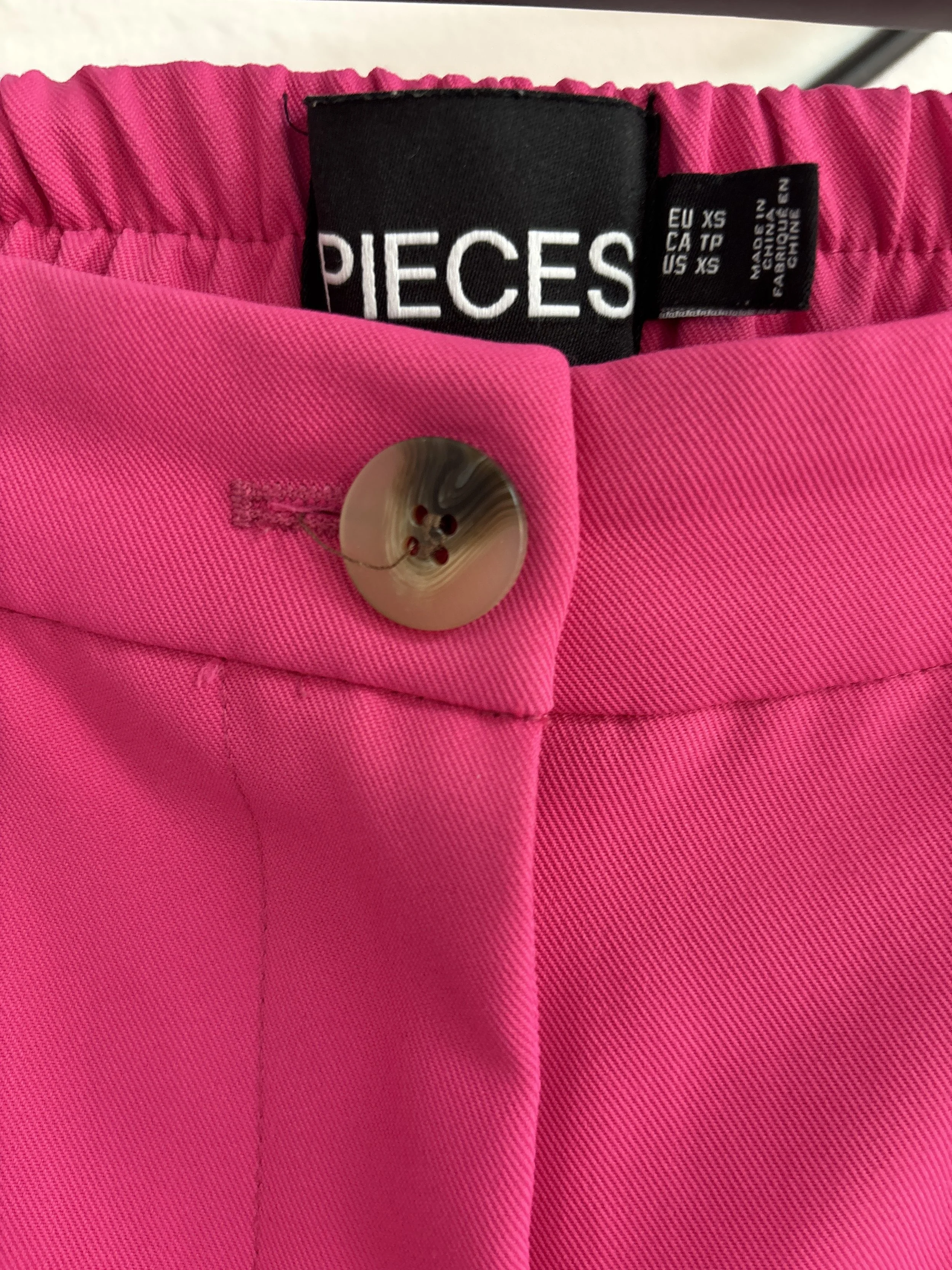 PIECES pink shorts brand label