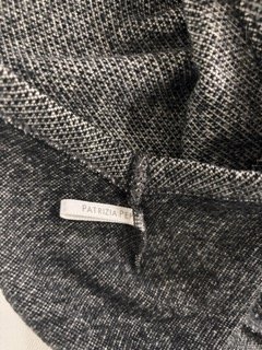 Close-up texture detail of Patrizia Pepe dark grey knit fabric and minimalist stitching