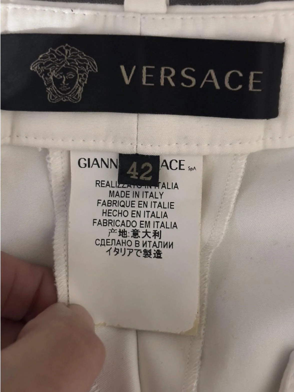 Gianni Versace authentic label made in Italy designer trousers interior tag detail