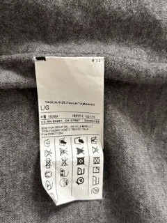 Sisley cardigan size label and care tag detail