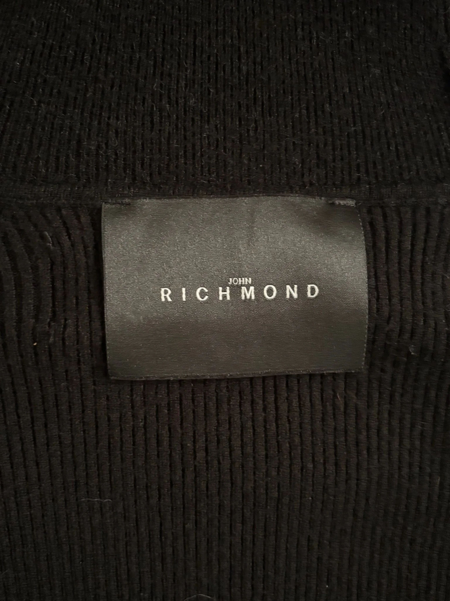 John Richmond black ribbed turtleneck sweater back logo detail close-up