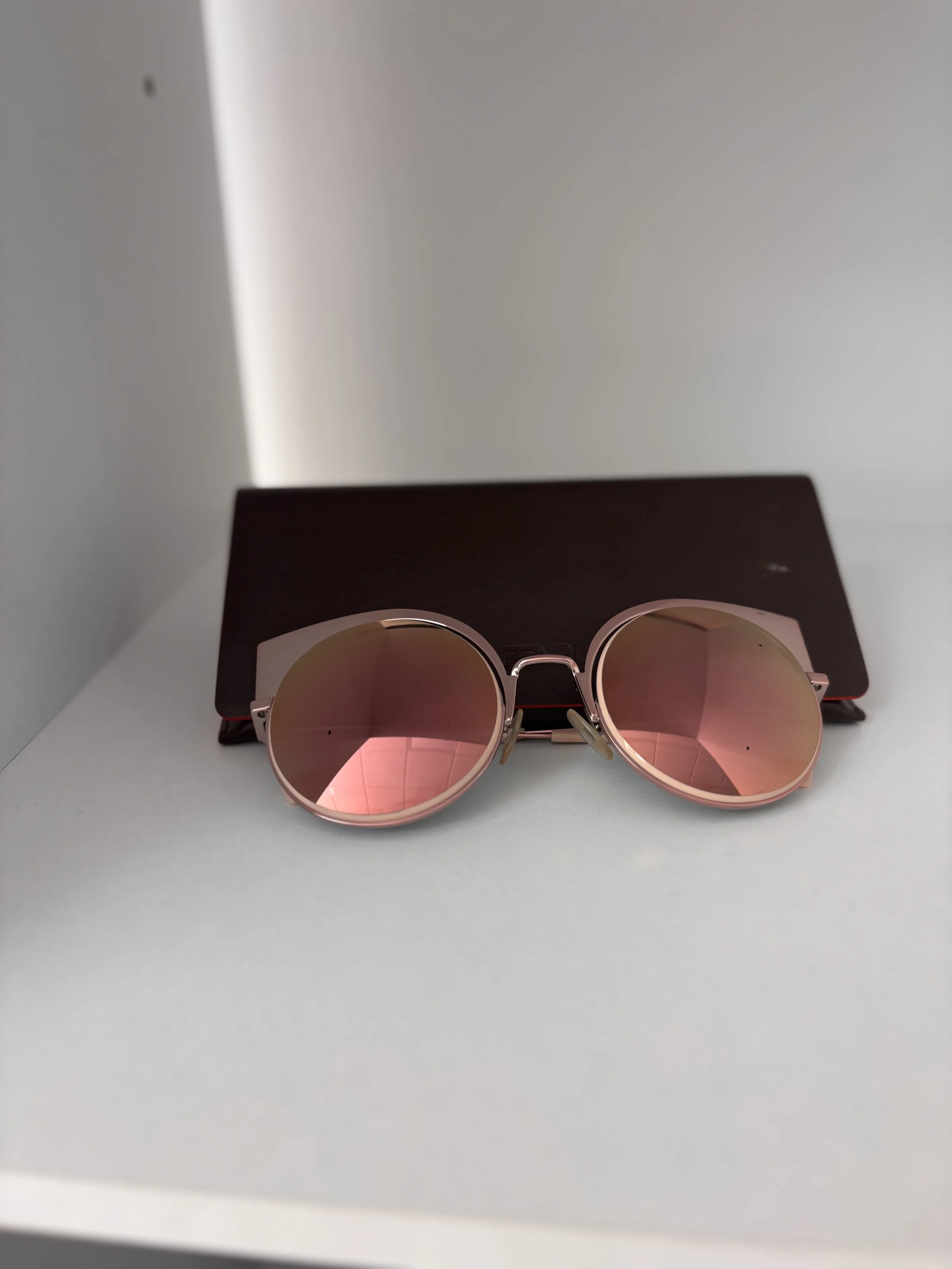 Fendi designer sunglasses with rose gold mirrored lenses and case