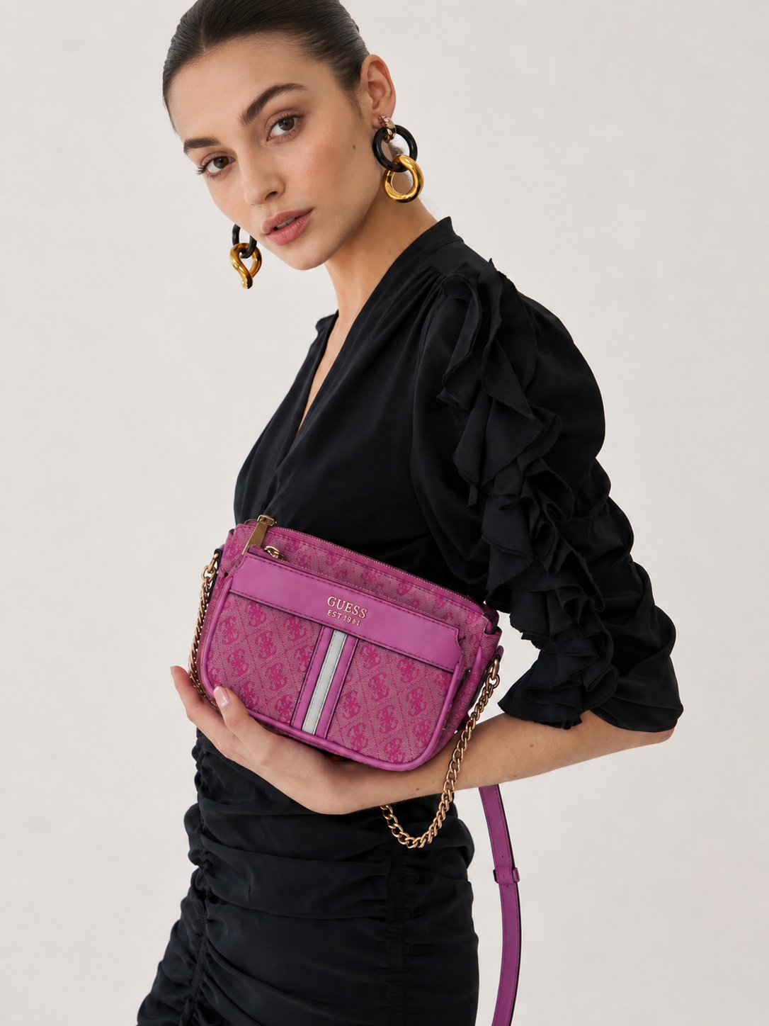 GUESS pink designer crossbody bag lifestyle view