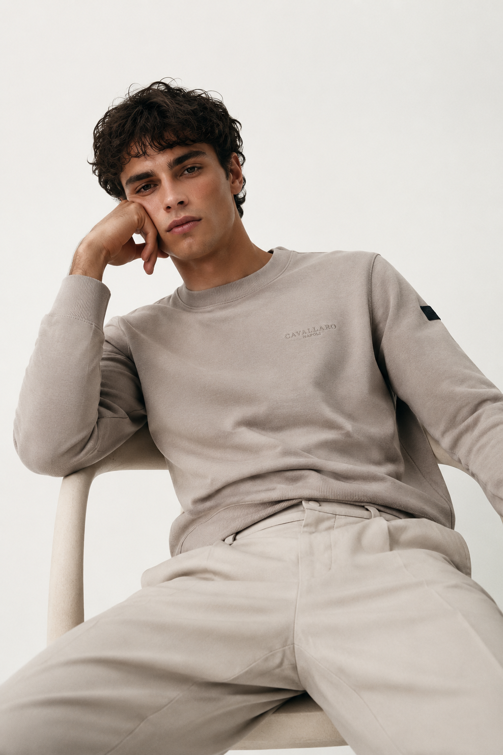 Men’s Cavallaro Napoli cream beige sweatshirt styled with light tailored trousers, showcasing an elegant smart casual and minimalist luxury aesthetic.