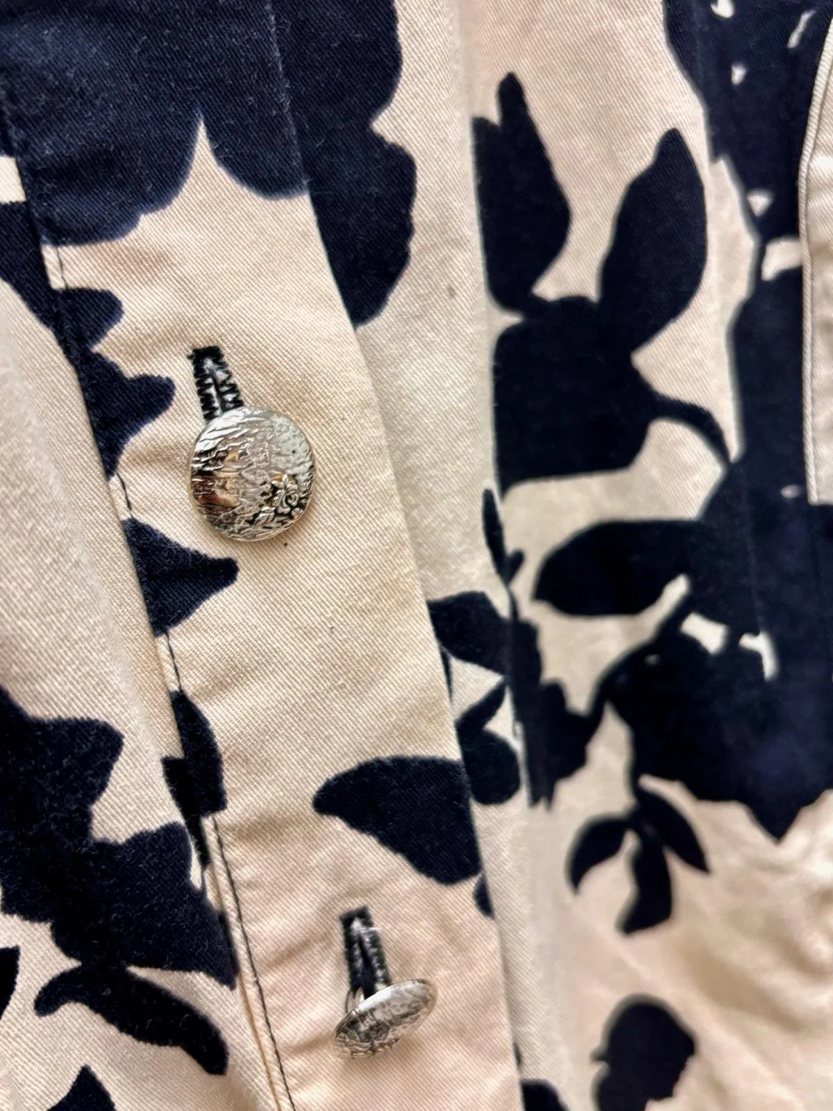 Granat Collection black floral print detail, button front and tailored waist