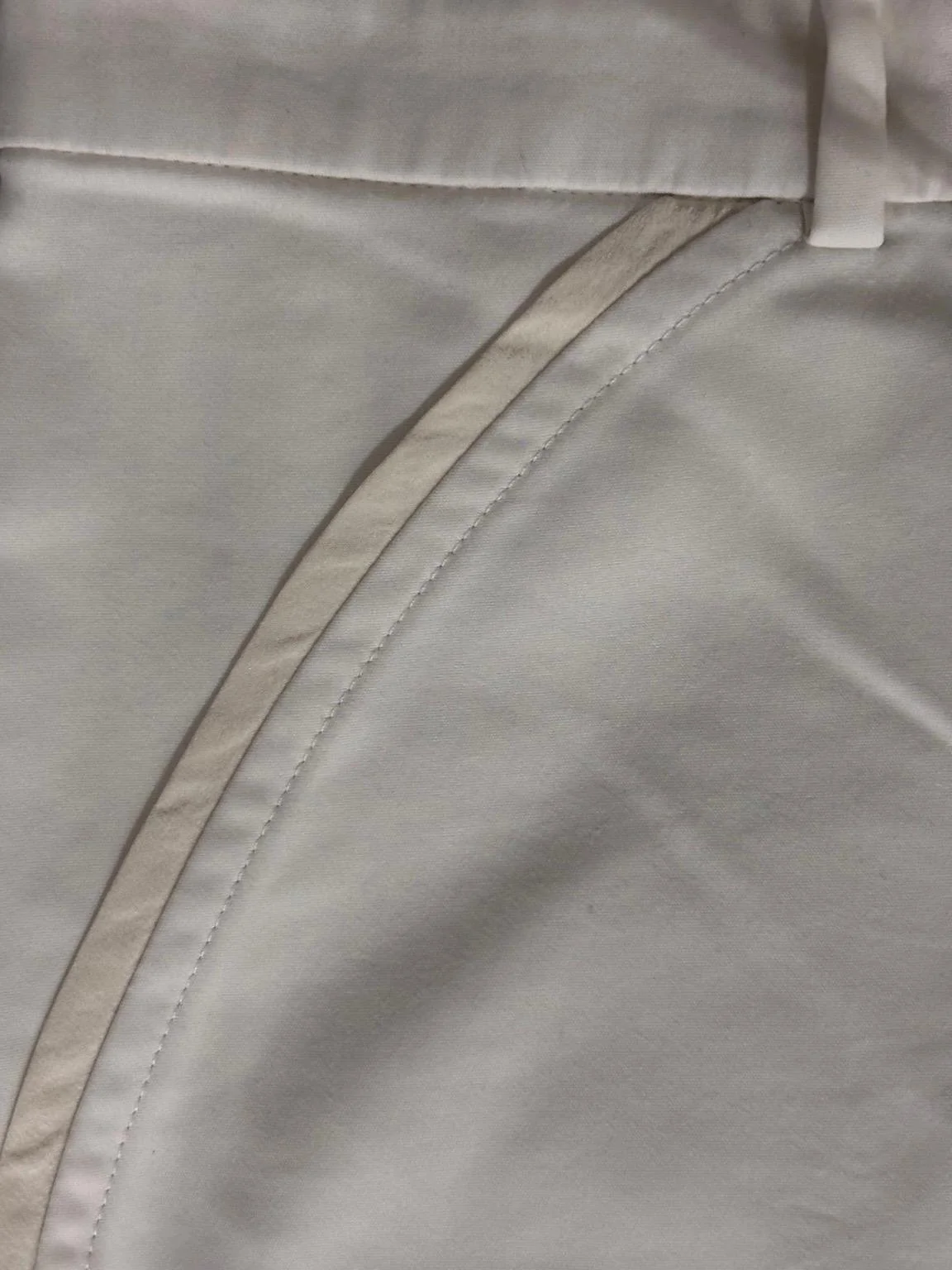 Gianni Versace cream tailored trousers interior stitching and pocket construction detail