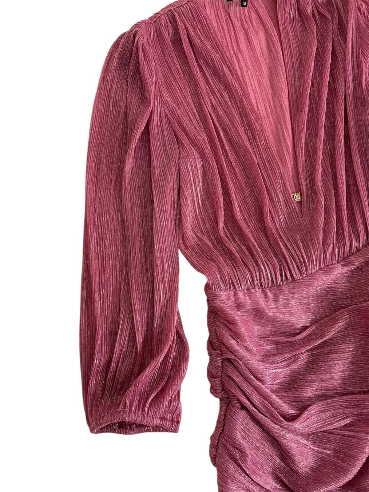 Close-up of ruched draping and long sleeve detail on Maje pink mini dress, women’s designer piece.