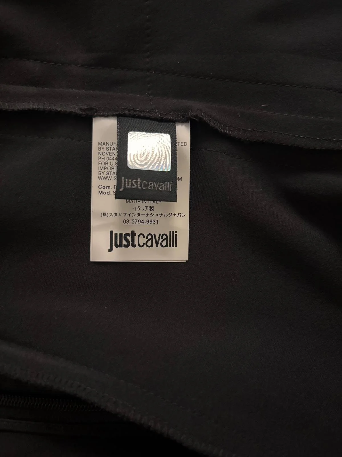 Just Cavalli original interior authenticity label and Made in Italy tag close-up