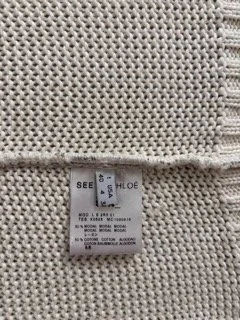 See by Chloé knitwear label and textured beige metallic knit fabric close-up made in Italy luxury women’s designer vest