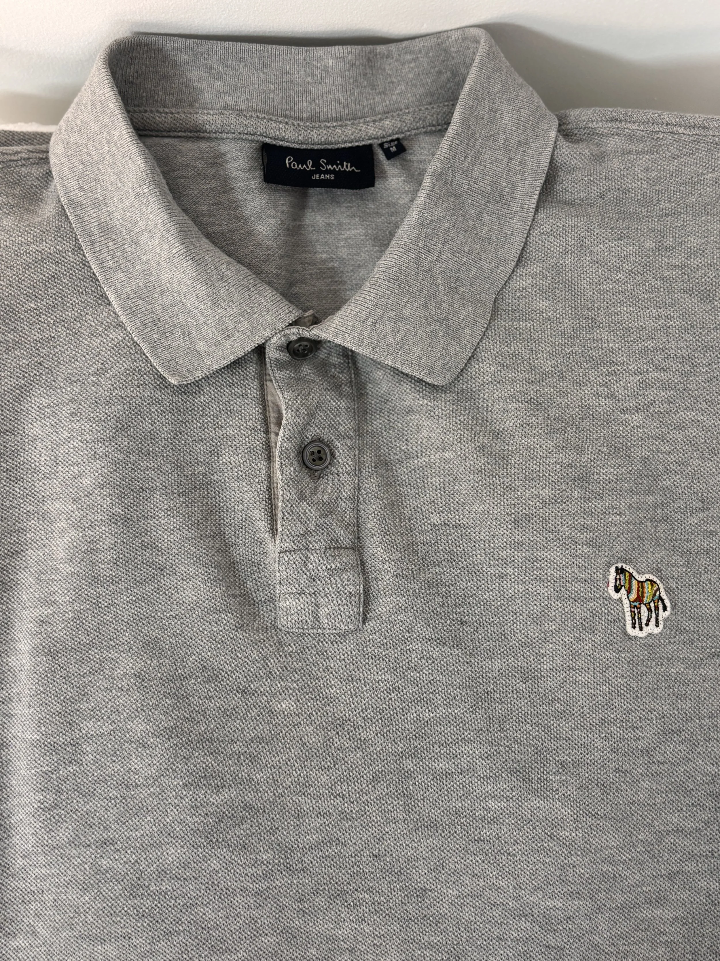 Paul Smith polo collar with signature zebra logo