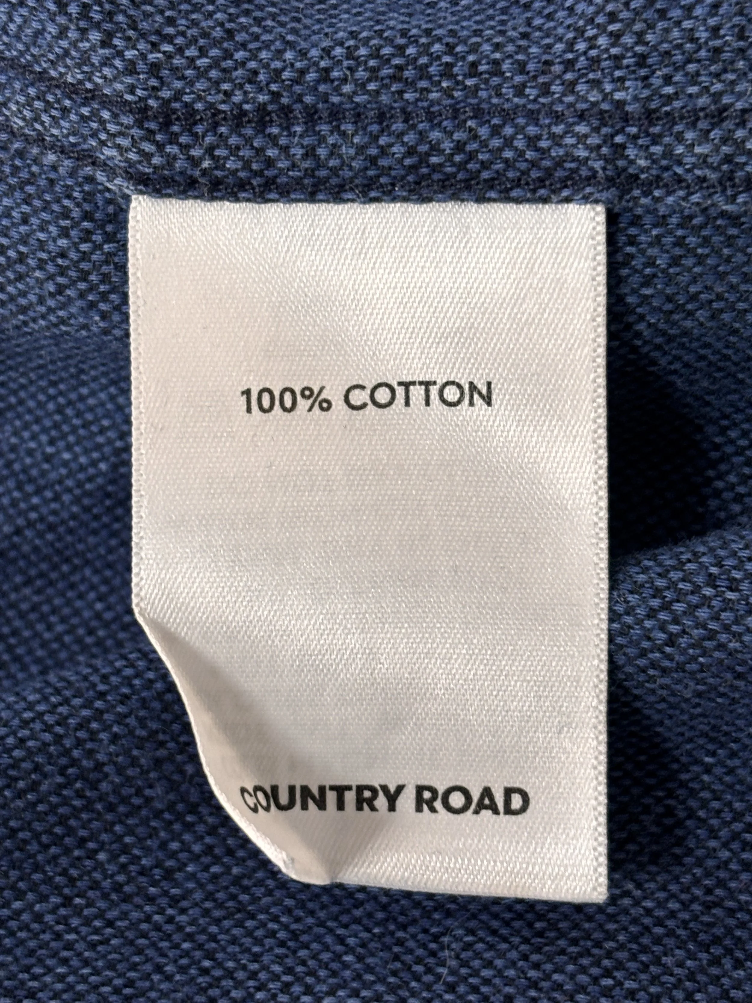 Original Country Road garment label confirming 100% cotton composition for the Indigo men’s premium shirt.