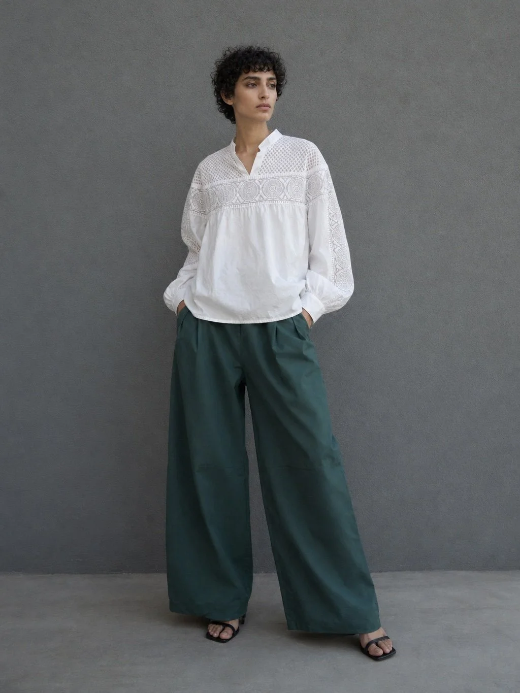 Full body model wearing white IRO embroidered blouse with bohemian lace details and relaxed silhouette luxury pre-owned designer look