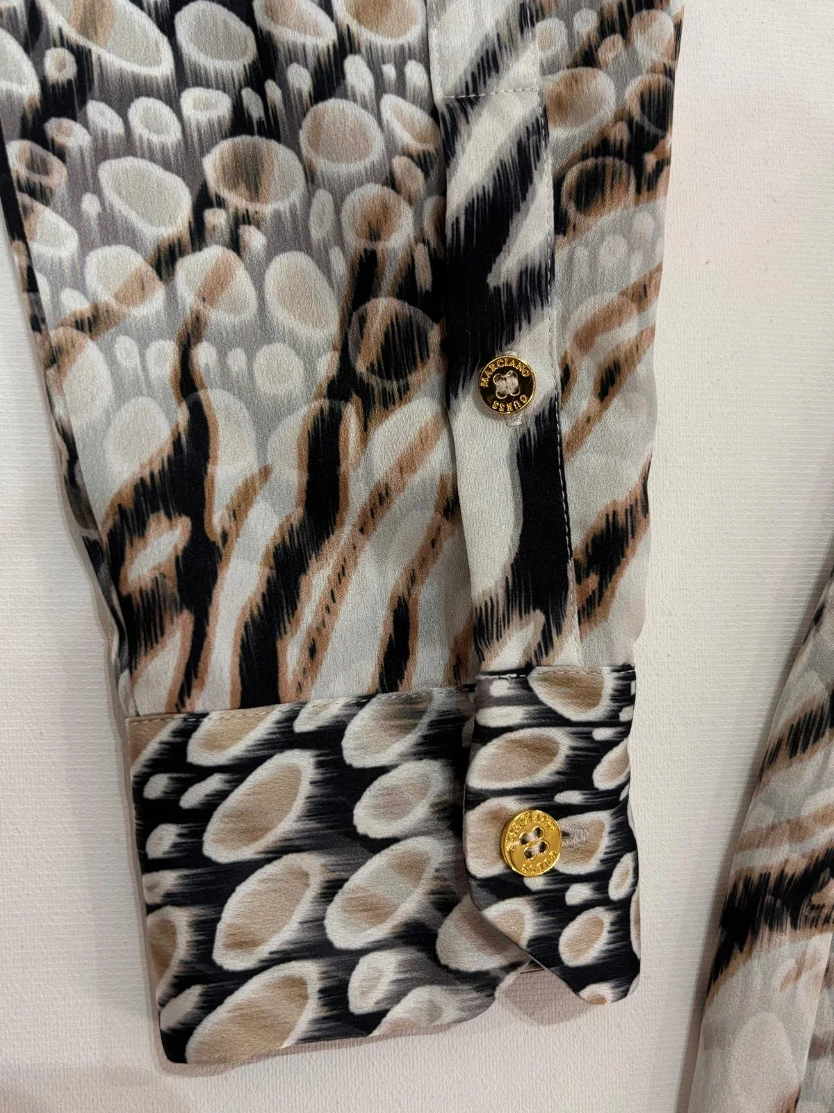 Merciano by Guess sleeve cuff with gold logo button detail