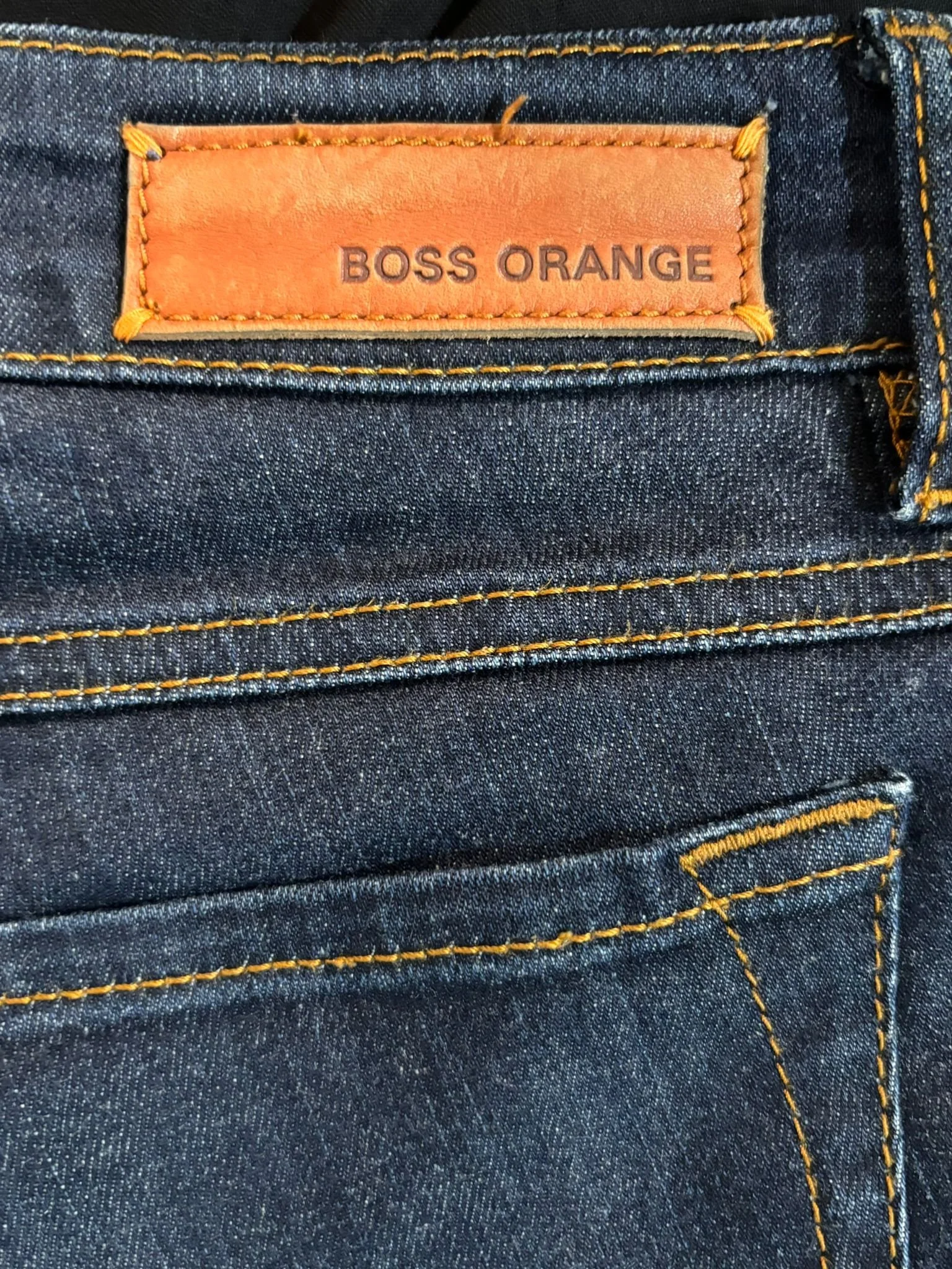 Hugo Boss Orange luxury designer jeans back label detail, premium denim craftsmanship, authenticated designer denim, Virtual Preview Available