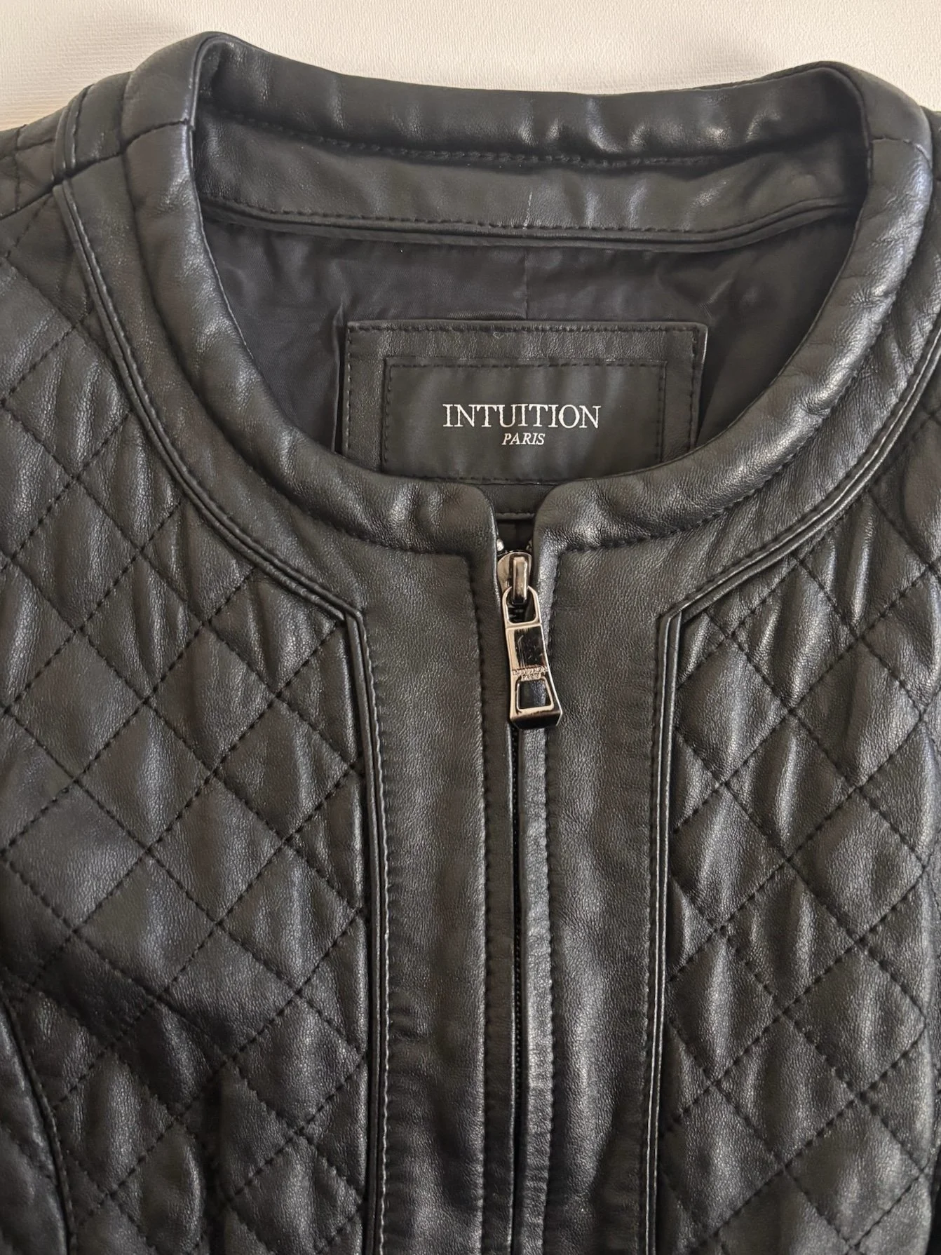 Intuition Paris black quilted lamb leather jacket collar and front zipper close-up