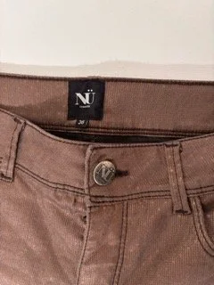 NÜ Denmark metallic bronze brown skinny jeans fabric close-up with subtle shimmer finish
