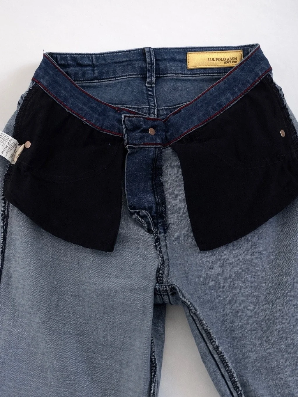 Inside view of U.S. Polo Assn. Boyfriend jeans with branded label and denim construction