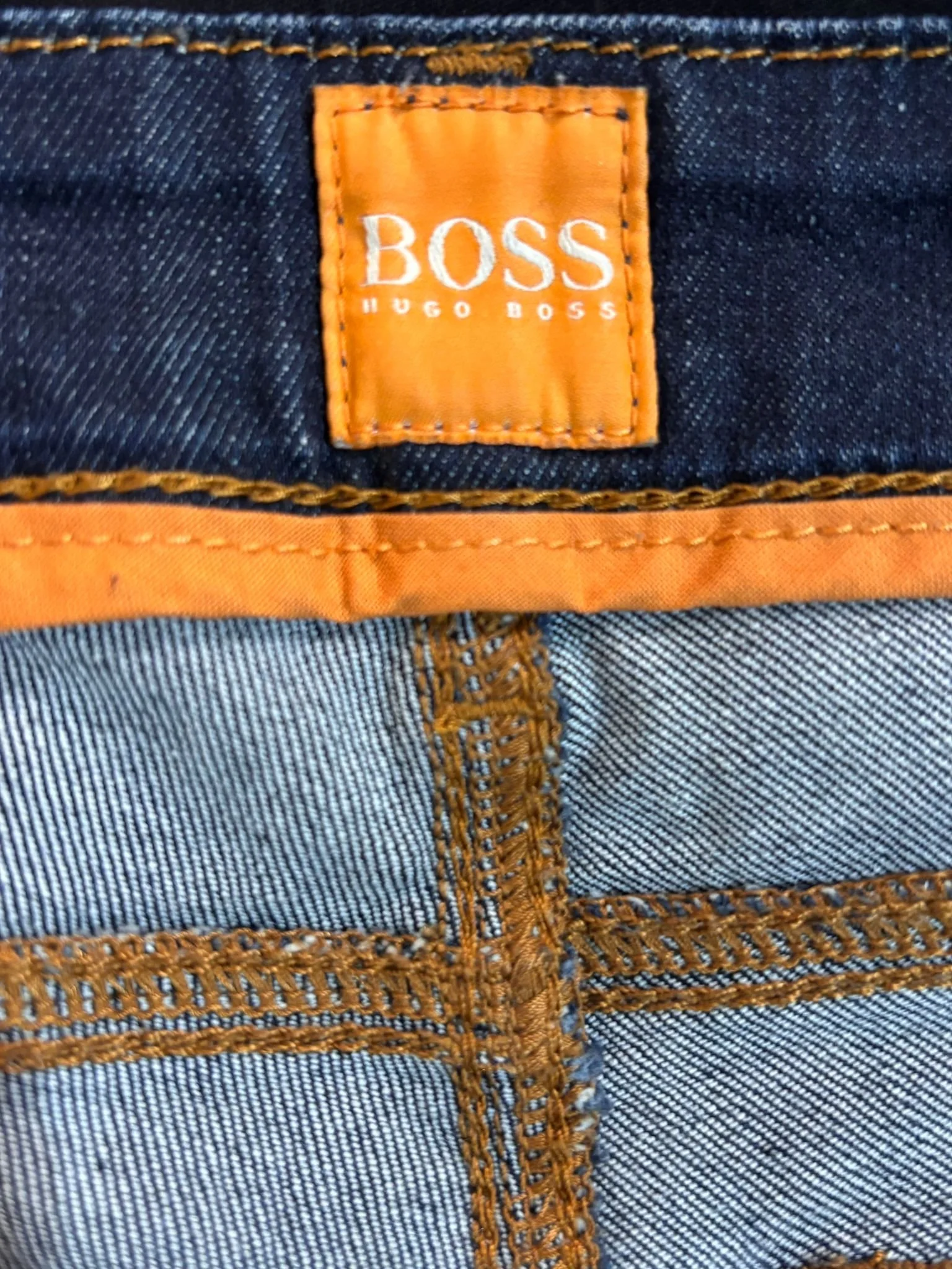 Hugo Boss Orange luxury designer denim jeans label detail, premium stitching and fabric texture, high-end resale jeans, Virtual Preview Available