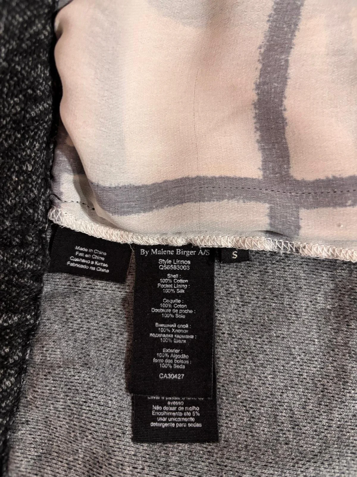 By Malene Birger logo and fabric detail on luxury joggers, premium material and craftsmanship close-up