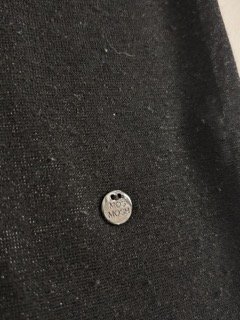 MOS MOSH silver logo hardware detail on black t-shirt hem