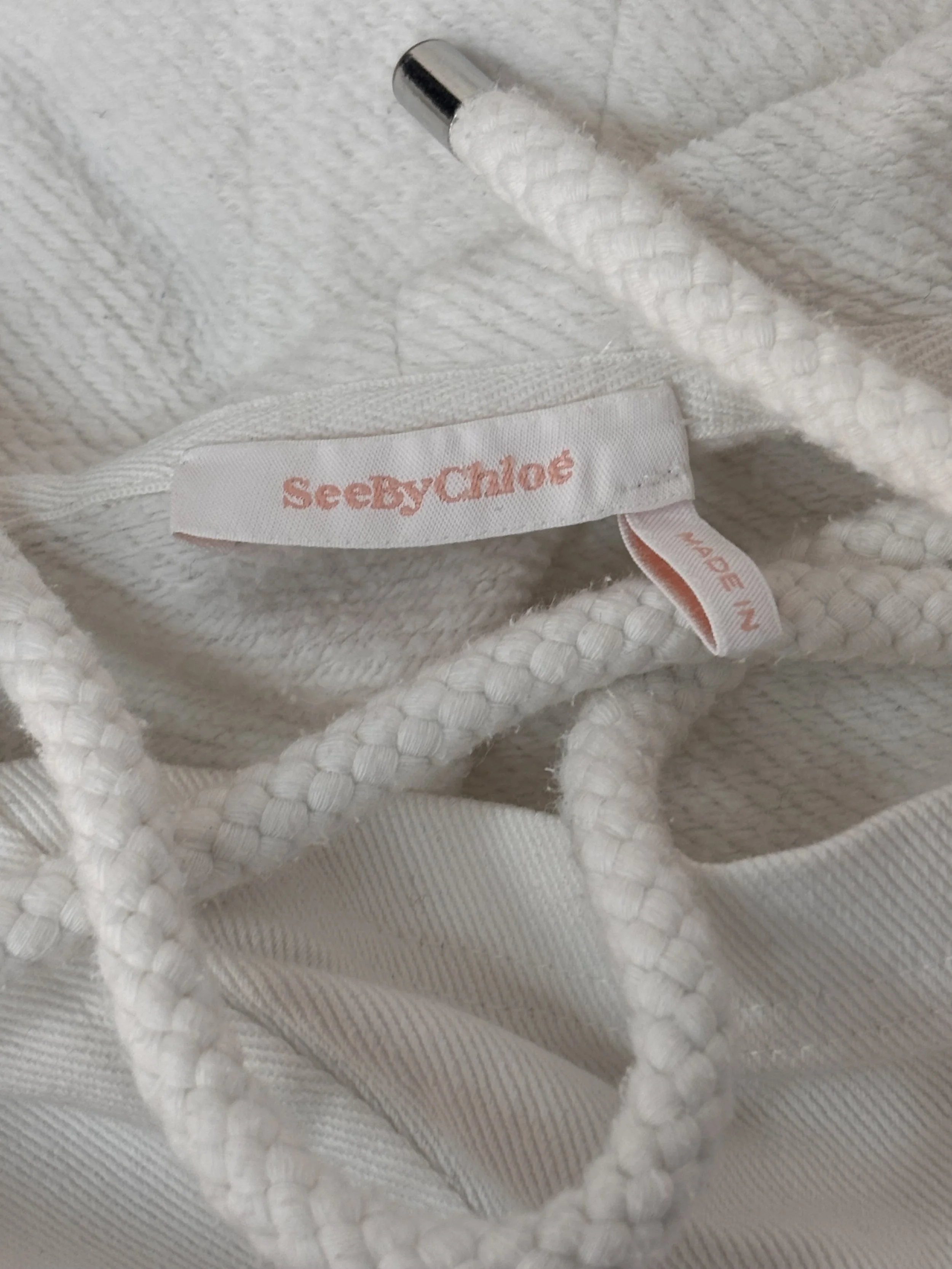 See by Chloé logo, hood drawcord and premium trim detail
