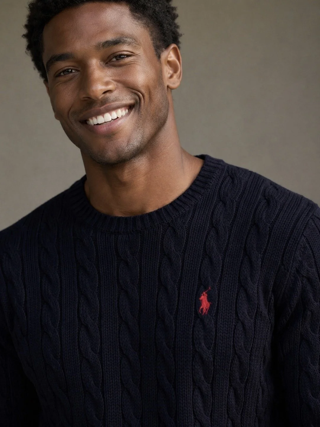 Close up Polo Ralph Lauren navy cable knit sweater red pony logo detail menswear