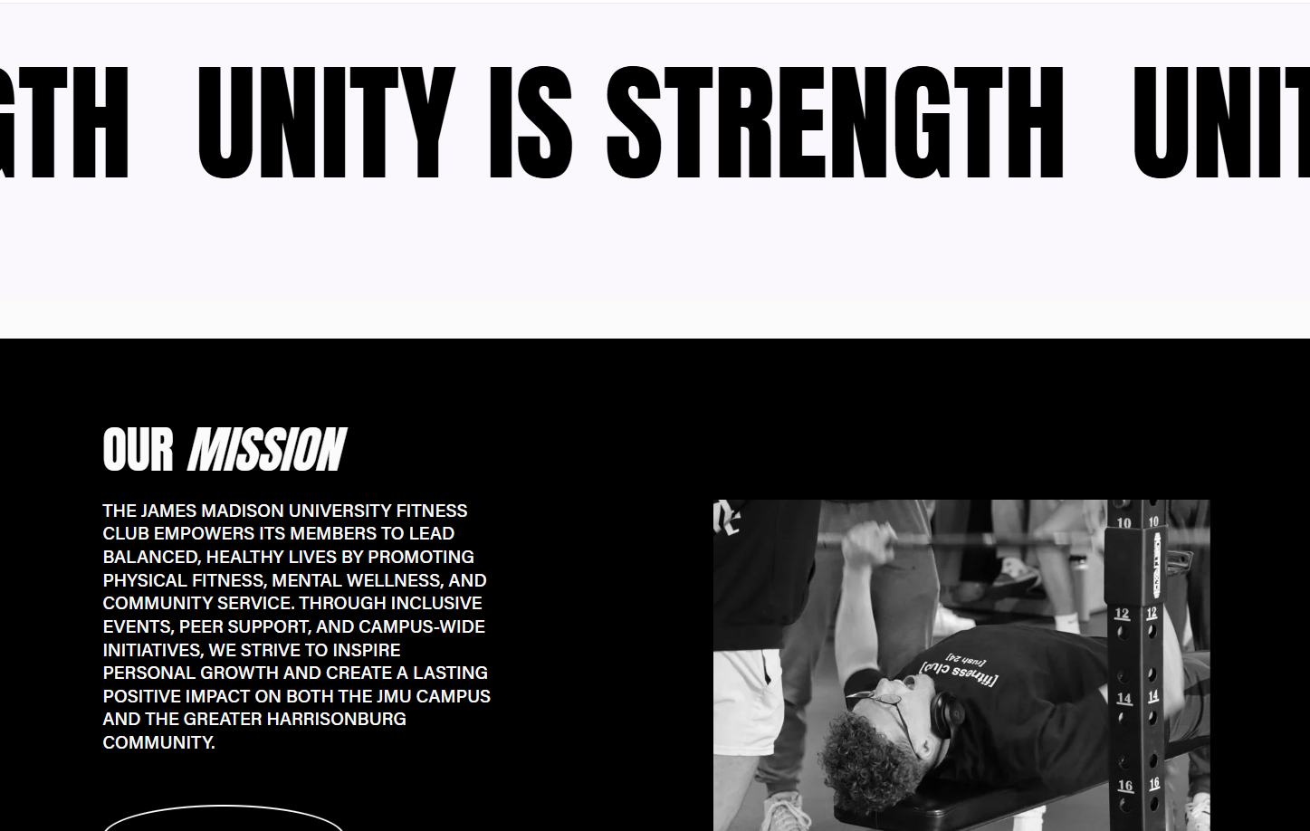 A black and white photo of a person lying on a bench in a gym, lifting a barbell, wearing headphones, with other gym equipment and people in the background.