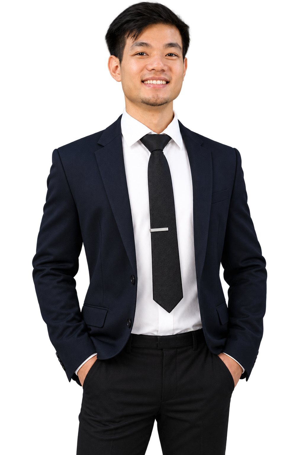 A young man in a suit smiling at the camera.