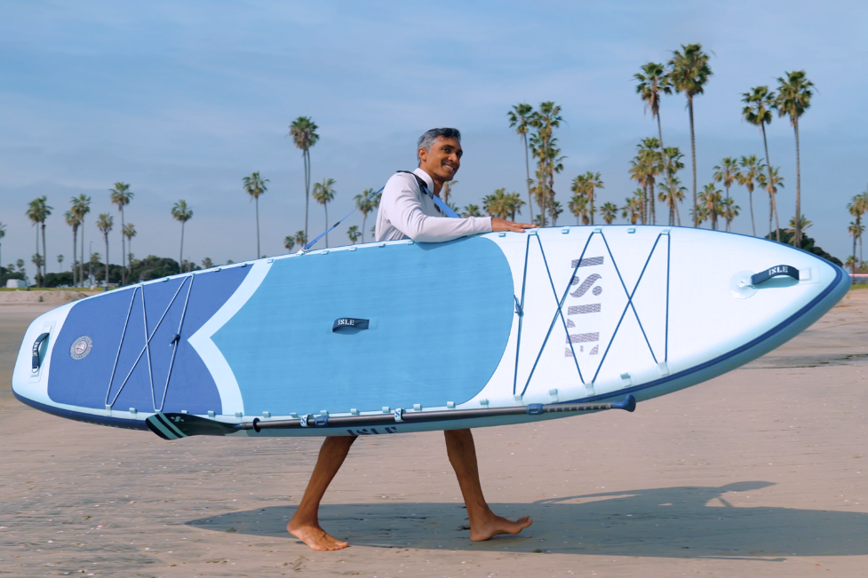 Dylan Jawahir Model Actor Carrying Paddle Board on the Beach