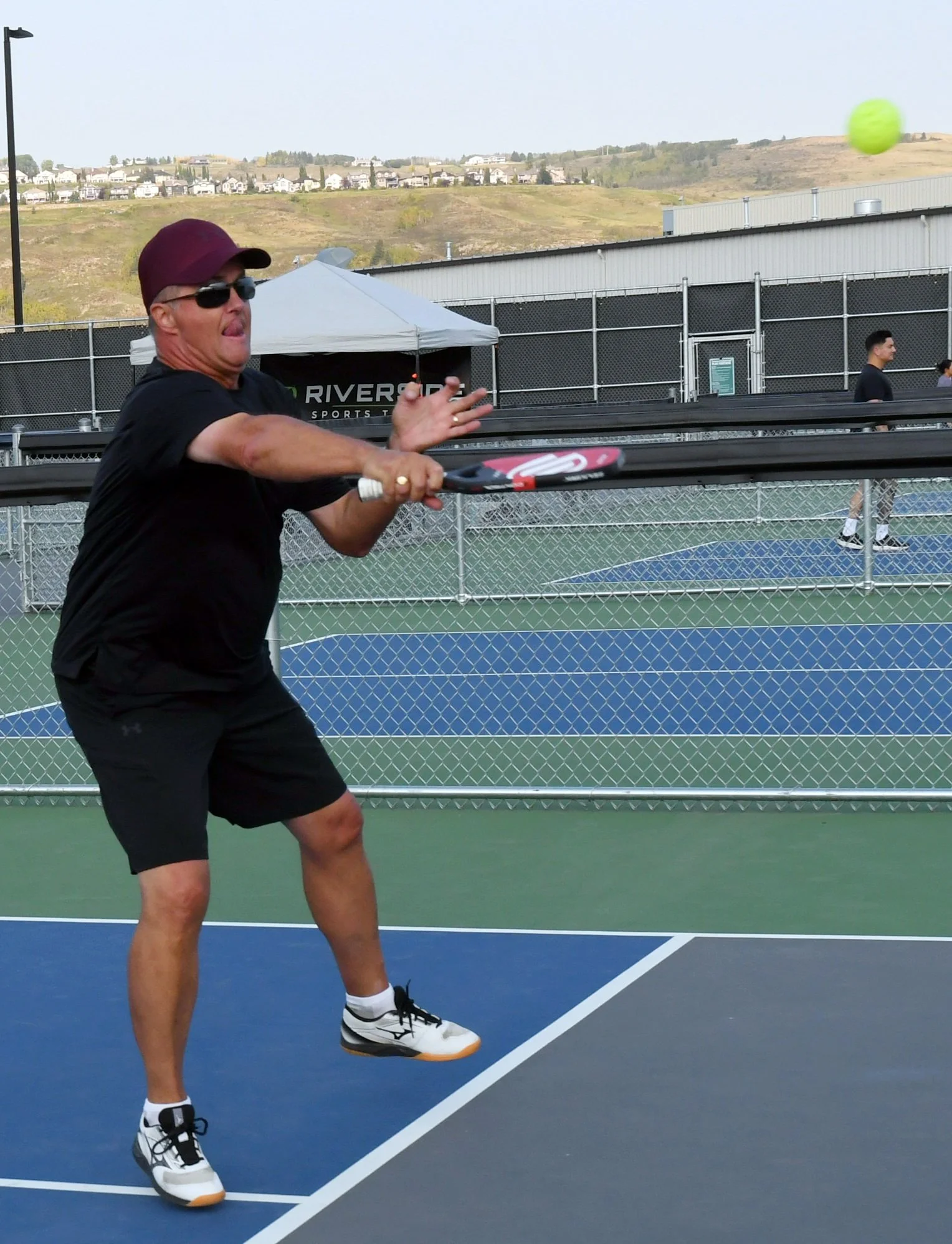 Playing pickleball in Cochrane, AB