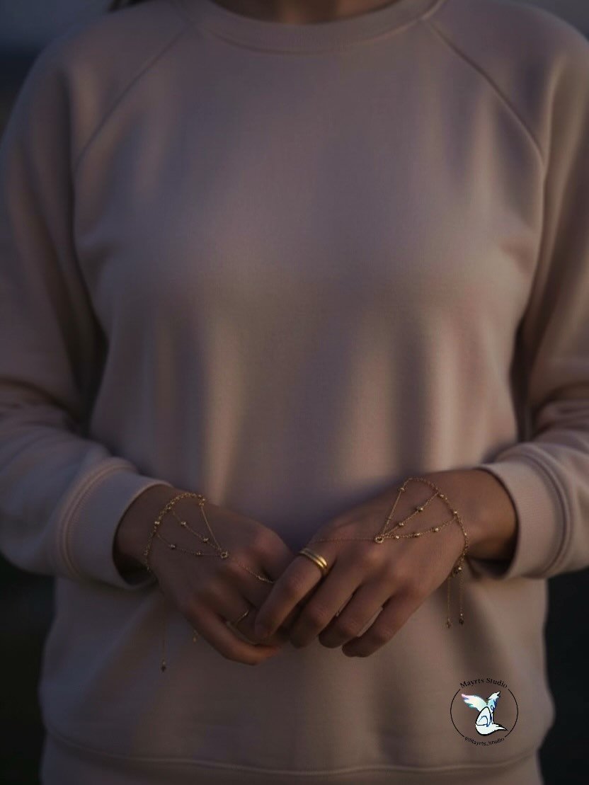 Golden in Motion

Worn, not styled.
Felt, not posed.

This piece reveals itself in small movements &mdash;
in the way the hand rests,
the way the light finds it,
the way it becomes part of the body without asking.

One-of-a-kind.
Handcrafted by Mayrt