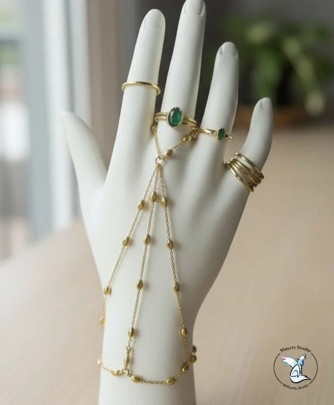 ✨ Golden in Motion

Designed as an extension of the hand —
fluid, intentional, and quietly striking.

Golden in Motion was created to move with you,
to catch light through gesture,
and to feel as delicate as it looks.

Handcrafted by Mayrts Studio.

