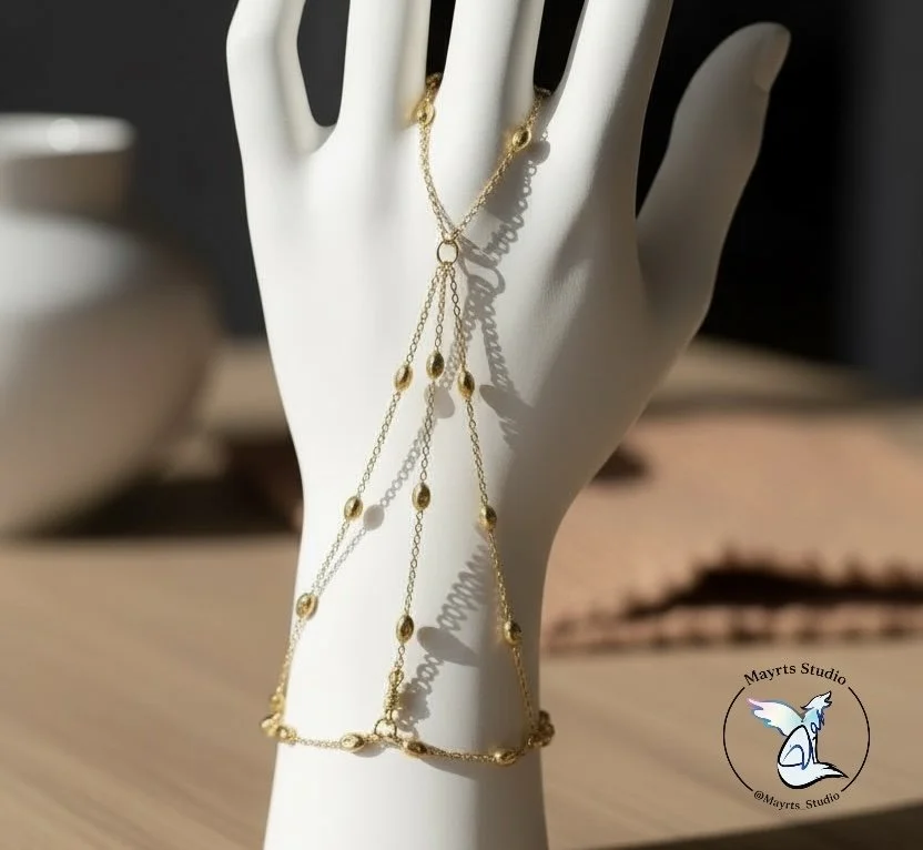 ✨ Golden in Motion

Designed as an extension of the hand —
fluid, intentional, and quietly striking.

Golden in Motion was created to move with you,
to catch light through gesture,
and to feel as delicate as it looks.

Handcrafted by Mayrts Studio.

