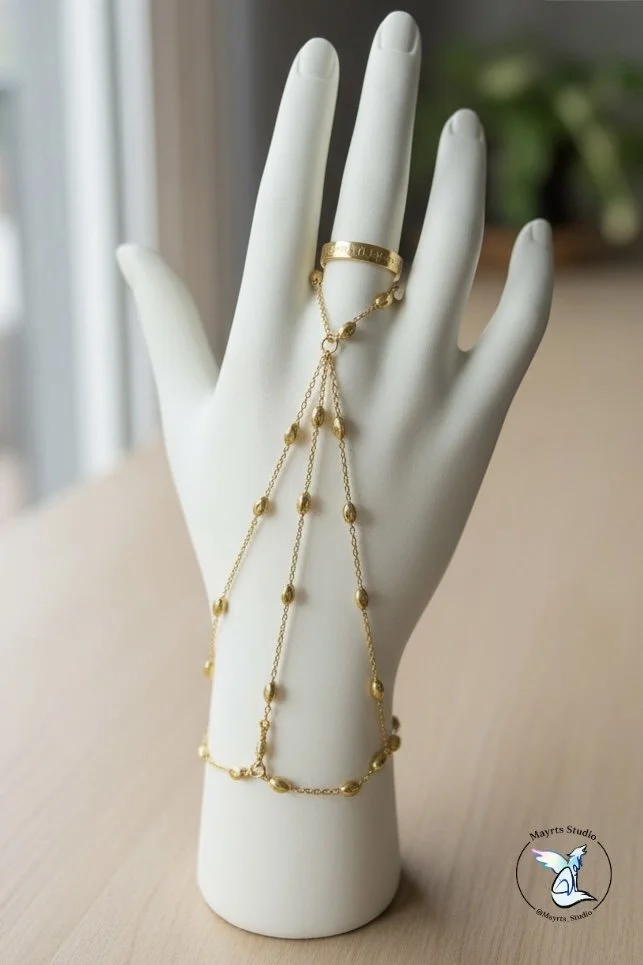 ✨ Golden in Motion

Designed as an extension of the hand —
fluid, intentional, and quietly striking.

Golden in Motion was created to move with you,
to catch light through gesture,
and to feel as delicate as it looks.

Handcrafted by Mayrts Studio.


