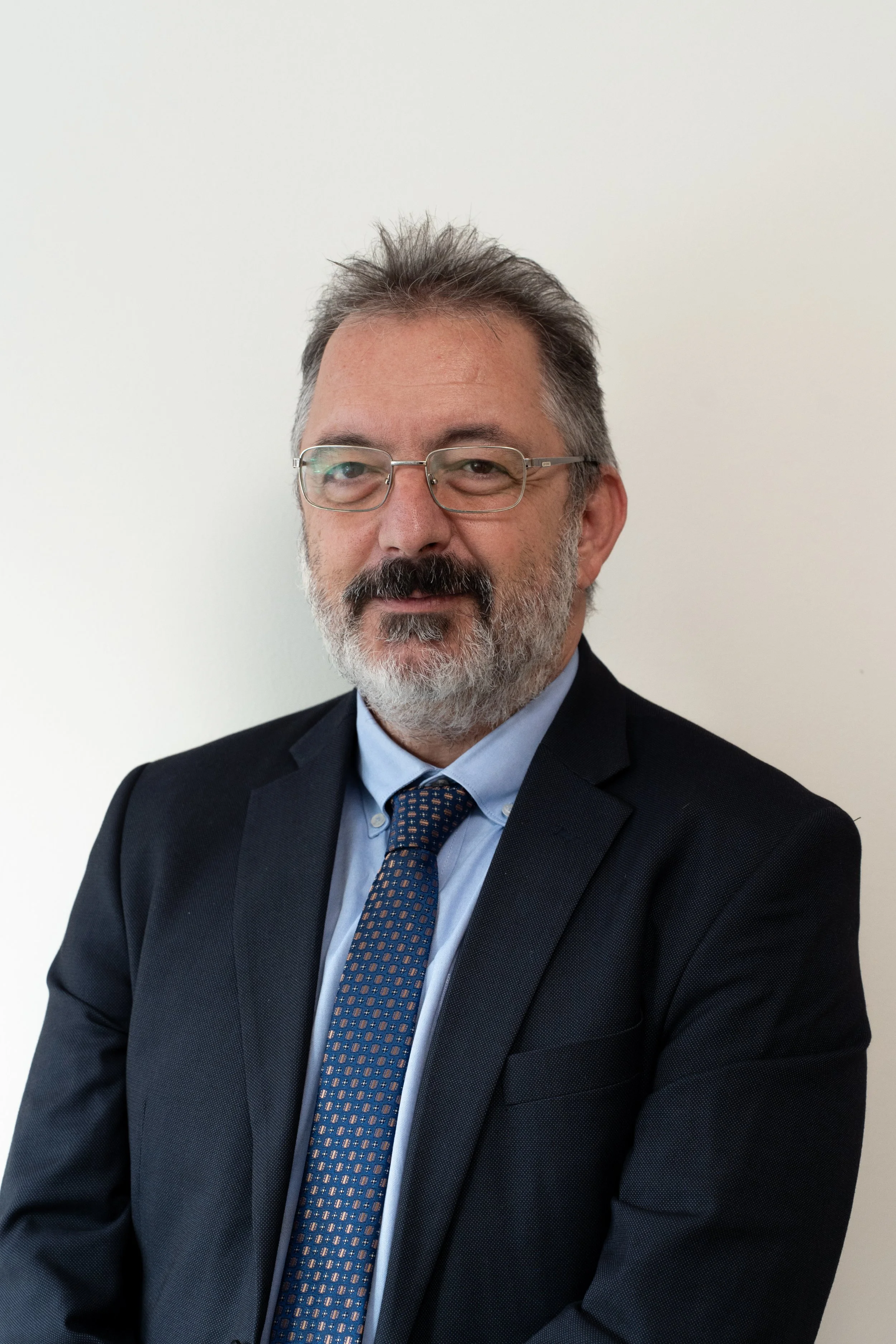 Generic gray silhouette icon of a person on a light gray background.