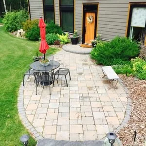 Curved Backyard Paver Patio for Outdoor Dining and Entertaining